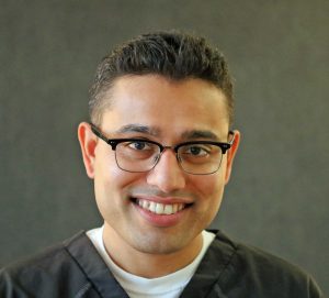 Staff member smiling at the camera