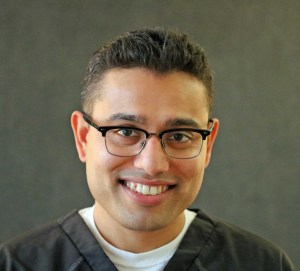Staff member smiling at the camera